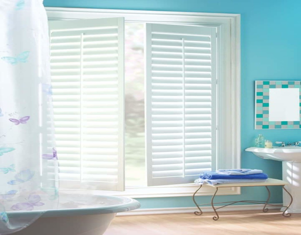 Bathroom window treatments for homes near Sea Island, Georgia (GA) including custom motorized shutters.