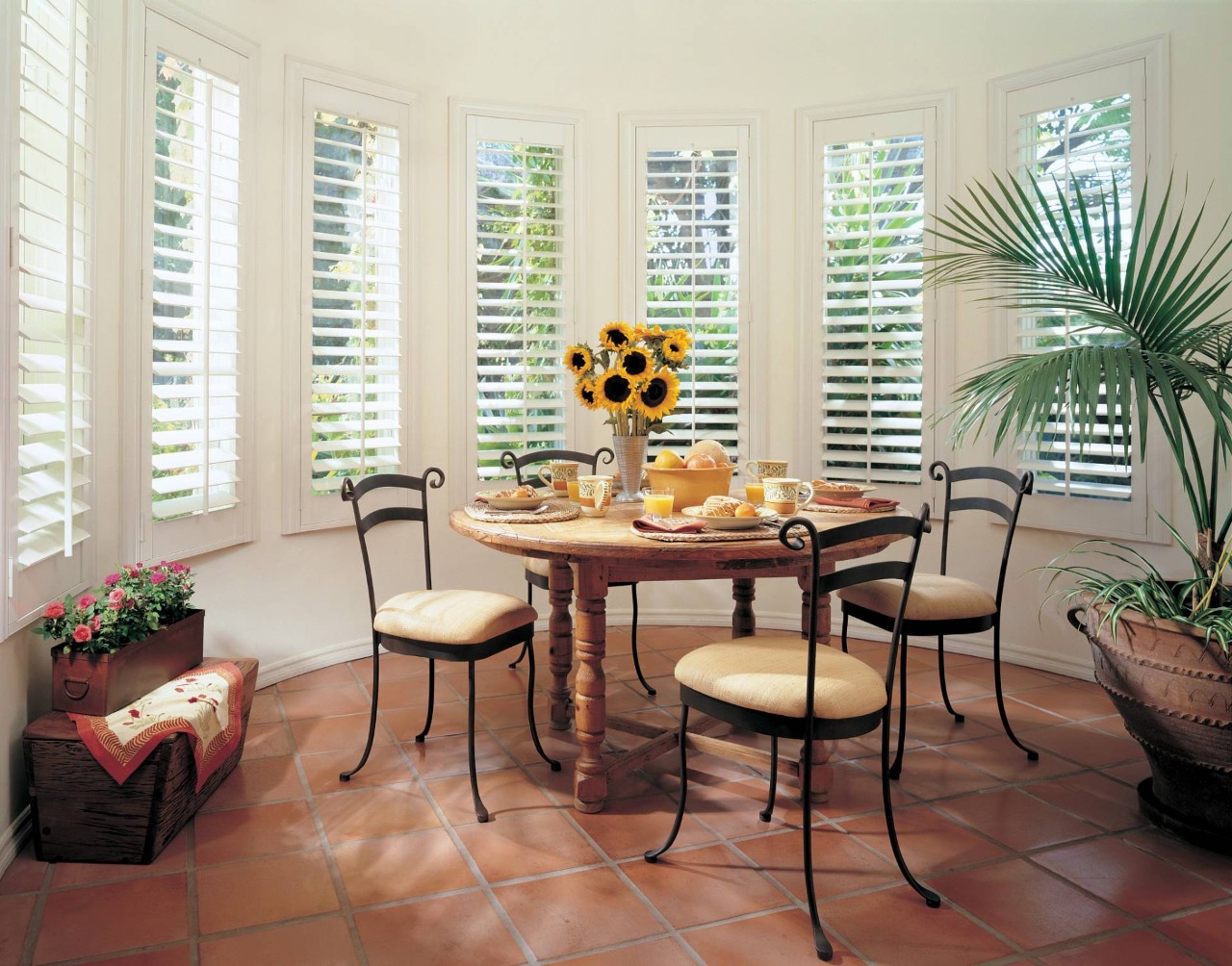 Hunter Douglas wood shutters blocking light in a cozy kitchen at Little’s Custom Blinds & Shutters near Brunswick, GA