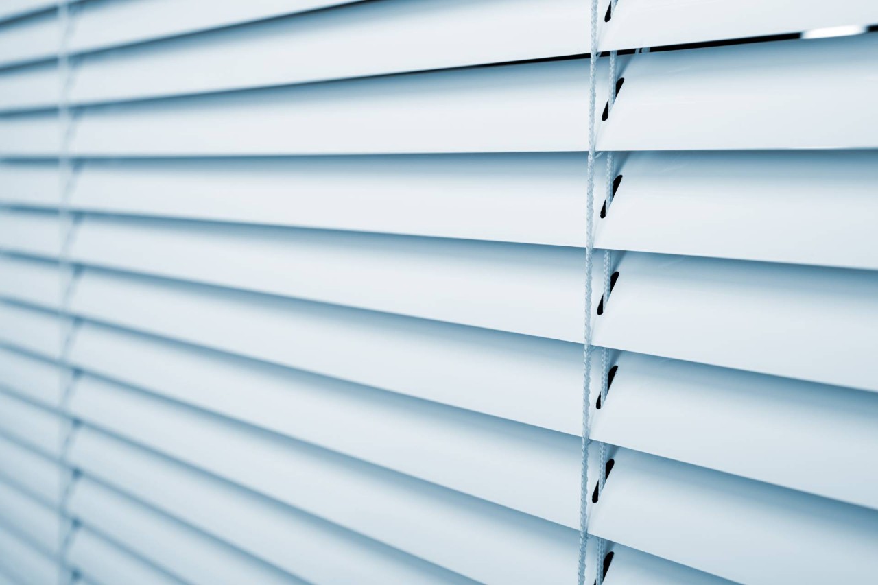 Indoor window blinds covering a window near Brunswick, GA